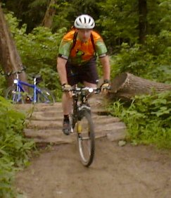 Riding over a pile of logs on the Minnesota River Bottoms trail